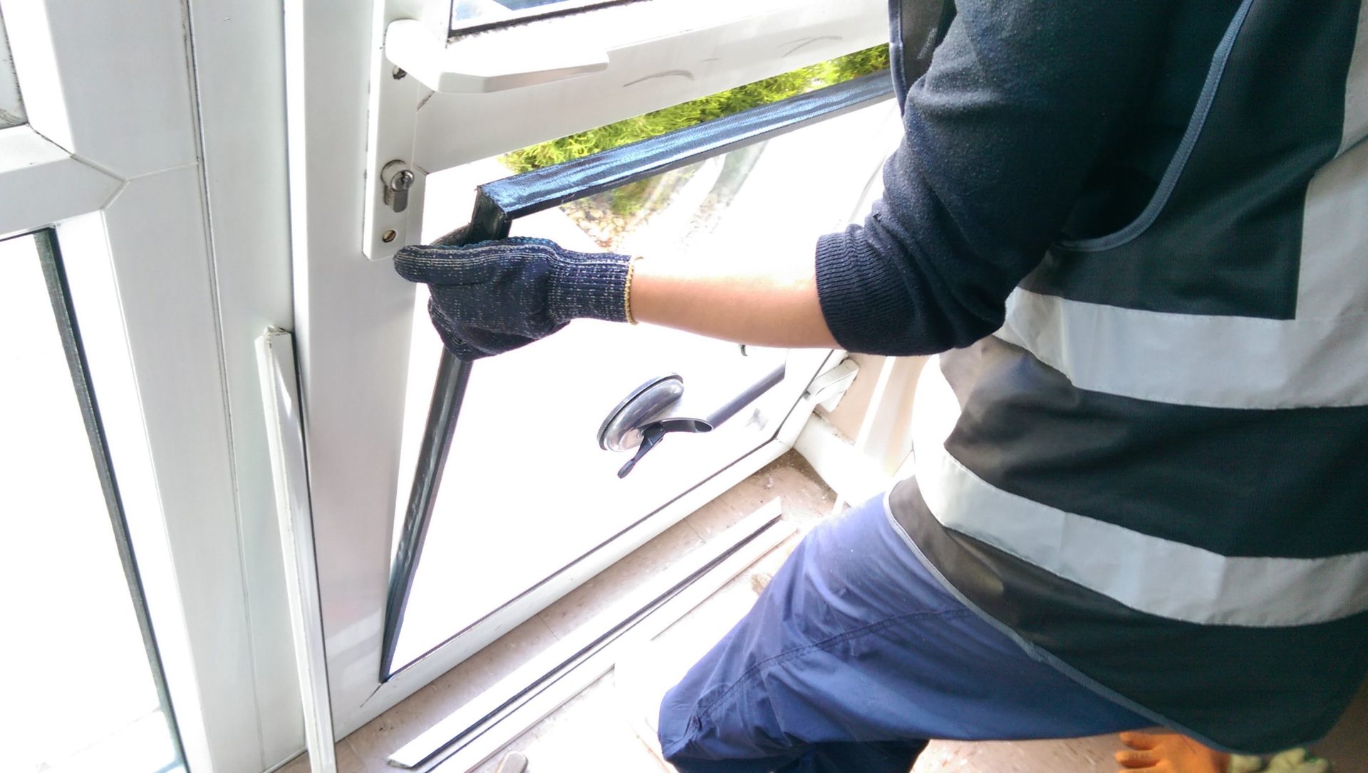 Replacing a damaged Window screen repair austin with a new energy-efficient model in Austin